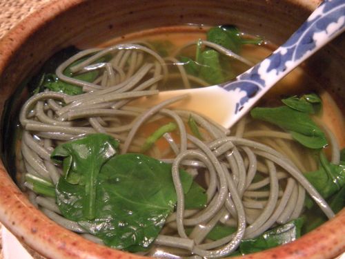 soba noodles in dashi broth with fresh baby spinach