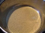 raw millet toasting in the pan. . . 